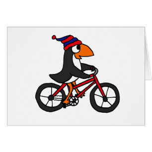 Pingüino divertido que monta la bicicleta roja