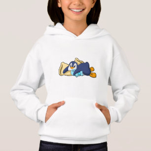 Pingüino durmiendo con almohada