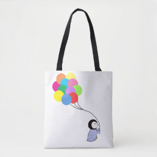 Pingüino lindo que sostiene la bolsa de asas de
