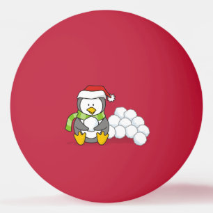 Pingüino navidad sentado con bolas de nieve