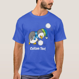 Pingüino pequeño recibiendo una camiseta con bolas