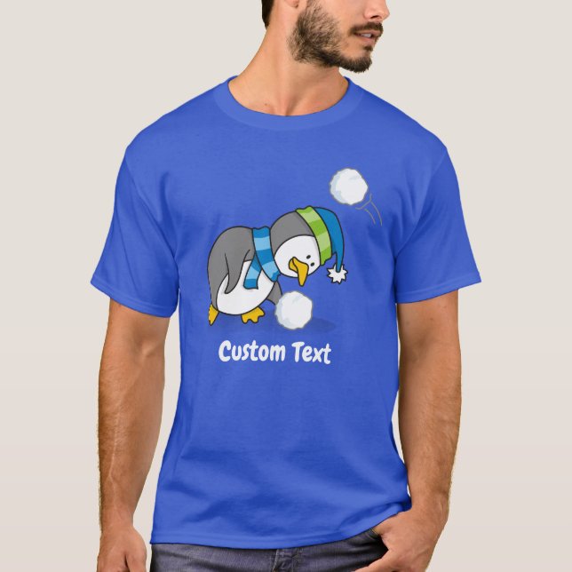 Pingüino pequeño recibiendo una camiseta con bolas (Anverso)