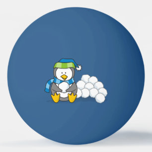 Pingüino pequeño sentado con bolas de nieve ping p
