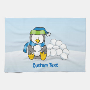 Pingüino pequeño sentado con toalla de cocina de b