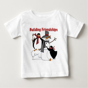 Pingüinos construyendo camisetas y regalos de amis