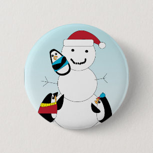 Pingüinos construyendo un botón de nieve