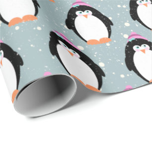 Pingüinos navidades en papel envuelto con copos de