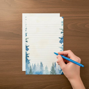 Pinos de invierno azules alineados con papelería
