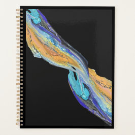 Pintura acrílica fluida hecha en un planificador