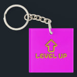 Pixel Level Up Gamer Llavero Electric Pink<br><div class="desc">Sube de nivel tu accesorio diario con este divertido llavero retro de juegos. Cuenta con un clásico arte de píxeles 8-bit de una flecha amarilla y el texto "Level Up" sobre un vibrante fondo magenta rosa. Este llavero cuadrado de acrílico es el accesorio perfecto para tus llaves, mochila o bolsa...</div>