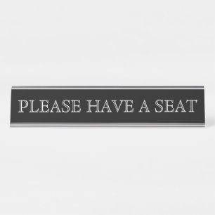 PLACA DE NOMBRE "POR FAVOR, TOME UN ASIENTO"