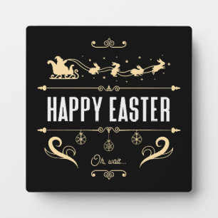Placa Expositora Feliz Pascua. Oh, espera... - Trineo de Santa y co