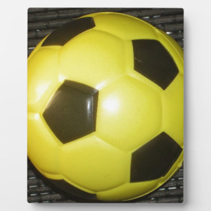 Placa Expositora Fútbol amarillo y negro.