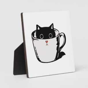 Placa Expositora Gatito negro con nariz roja escondido en una taza