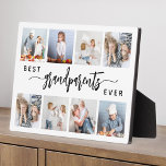 Placa Expositora Los mejores abuelos del mundo 8 Collage de fotos b<br><div class="desc">Dale a los mejores abuelos un regalo que apreciarán. Esta placa de collage de fotos muestra ocho de sus fotos cuadradas favoritas de los nietos, junto con el mensaje "Los mejores abuelos de la historia". La palabra "abuelos" aparece en un elegante guión de escritura a mano en negro con flores...</div>