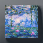 Placa Expositora Monet Water Lilies Plaque<br><div class="desc">placa de Monet Water Lilies. Pintura de óleo sobre lienzo de 1916. Monet pintó su famoso estanque de nenúfares obsesivamente durante los últimos años de su carrera, inspirándose en la luz del sol y su efecto cambiante sobre el agua y las flores acuáticas y el follaje. Este cuadro presenta un...</div>