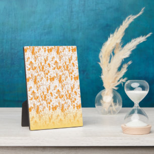 Placa Expositora Patrón textil con un vibrante naranja y gol