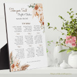 Placa Expositora Tabla de asientos de Terracotta Boda Floral<br><div class="desc">Cree una impresionante y única pantalla para su recepción de bodas con esta placa de mesa con una pluma boho y una tabla de asientos florales. Esta placa presenta un hermoso diseño de flores bohemias, pampas marrones y elementos de caída, junto con tus nombres, fechas de boda y asignaciones de...</div>