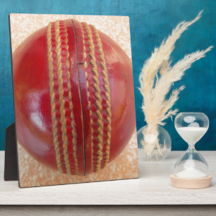 Placa Expositora Última bola roja de críquet