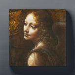 Placa Expositora Virgen Da Vinci de las Rocas Angel Plaque<br><div class="desc">Placa Leonardo da Vinci Virgen de los Rocks Angel. Óleo sobre lienzo 1495-1508. Da Vinci creó dos diferentes obras Madonna de las Rocks durante su carrera. Este trabajo presenta a la Virgen María sentada con el niño Jesús y el niño Juan Bautista como un ángel femenino mira. Este es un...</div>