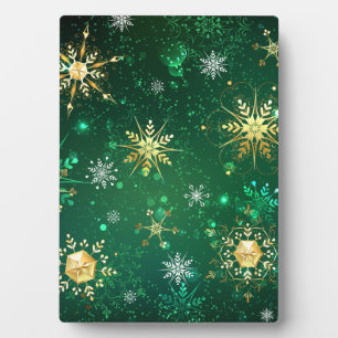 Placa Expositora Xmas copos de nieve dorados sobre fondo verde