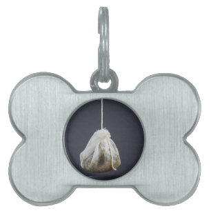 Placa Para Mascotas Bolsa de té colgada en una taza