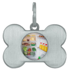 Placa Para Mascotas Nevera abierta llena de comida