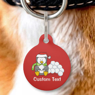Placa Para Mascotas pingüino de Navidad sentado con bolas de nieve