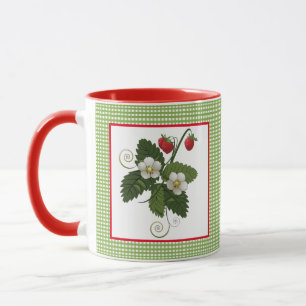 Planta de fresa con taza en la frontera de Gingham