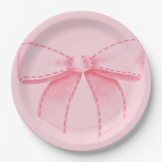 Plato de papel con lazo rosa con fondo rosa liso