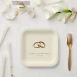 Plato De Papel Elegant Gold Minimalist Rings<br><div class="desc">This elegant wedding plate features a minimalist design with two interlocking golden rings set against a soft beige background, creating a luxurious and sophisticated look. The clean layout emphasizes the unity symbolized by the intertwined rings, while the classic serif font adds a touch of formality to the overall aesthetic. Perfect...</div>