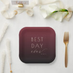 Plato De Papel Joyful Maroon Minimalist Wedding Plates<br><div class="desc">This elegant wedding plate features a gradient background transitioning from deep maroon to darker shades, creating a sophisticated and warm ambiance. The design includes the phrase "BEST DAY ever" in a mix of bold uppercase and delicate cursive typography, conveying a celebratory mood. With its minimalist layout and soft cream text...</div>