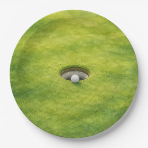 Plato De Papel La pelota de golf está junto al hoyo en el green d
