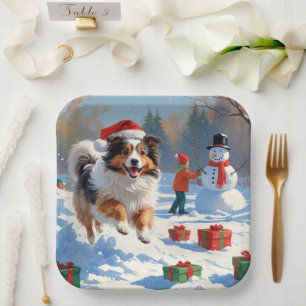 Plato De Papel Perro de pastor de Shetland corriendo en la nieve