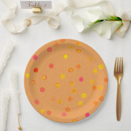 Platos de fiesta de papel naranja con espirales de