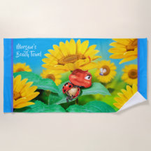 Girasoles soñolientos de la mariquita de la toalla