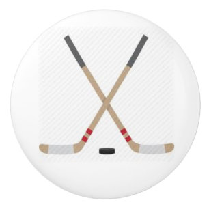 Pomo cerámico con palos de hockey y polla