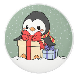 Pomo De Cerámica Pingüino lindo con regalos de Navidades en la neva