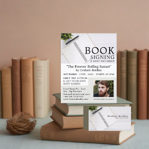 Portátil y pluma, publicidad de firma de libros de