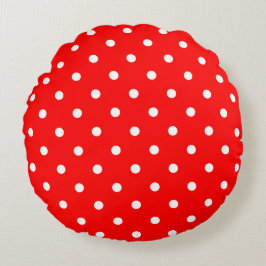 Pos rojos de polka alrededor de la almohada
