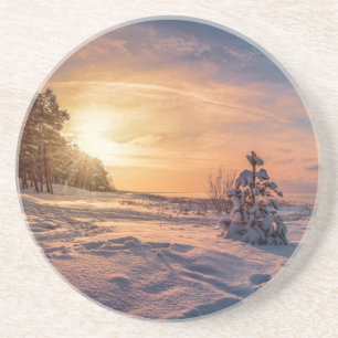 Posavasos Atardecer sobre la nevada costa del mar de inviern