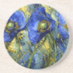 Posavasos Blue Poppies in Gold Swirl<br><div class="desc">Immerse yourself in the bold elegance of this abstract watercolor painting featuring three vivid royal blue poppies set against a background of swirling gold and green accents. The dynamic brushwork and fluid splashes create a sense of motion and richness, making this piece a captivating addition to any modern or eclectic...</div>