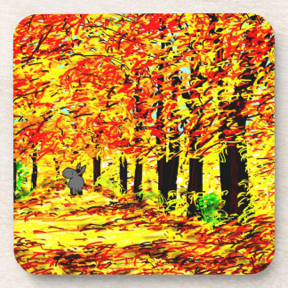 Posavasos burro que camina a través de las hojas de otoño