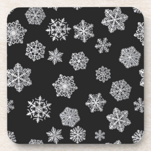 Posavasos Copo de nieve plateados sobre un fondo negro