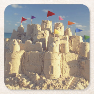 Posavasos Cuadrado De Papel Castillo de arena en la playa