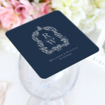Posavasos Cuadrado De Papel Escudo de monograma vintage nombra Boda azul de la<br><div class="desc">Este elegante diseño presenta un escudo de acanthus, inspirado en la vintage de regencia, que enmarca dos iniciales de monograma en el tipo de letra serif abierto, apilado verticalmente y separado por una delgada línea horizontal. Añada a continuación los nombres de la pareja y la fecha de boda. El diseño...</div>