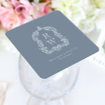 Posavasos Cuadrado De Papel Escudo de monograma vintage Nombres Boda azul turb<br><div class="desc">Este elegante diseño presenta un escudo de acanthus, inspirado en la vintage de regencia, que enmarca dos iniciales de monograma en el tipo de letra serif abierto, apilado verticalmente y separado por una delgada línea horizontal. Añada a continuación los nombres de la pareja y la fecha de boda. El diseño...</div>