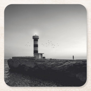 Posavasos Cuadrado De Papel Faro en la puesta del sol