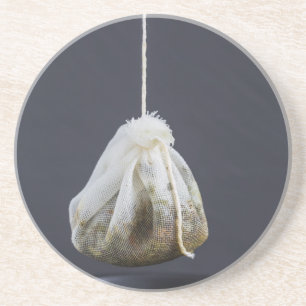 Posavasos De Arenisca Bolsa de té colgada en una taza