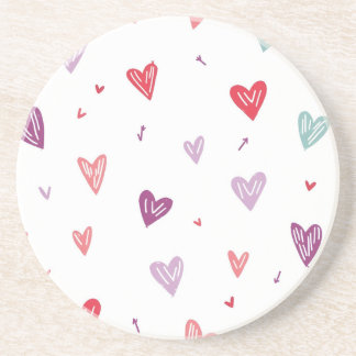 Posavasos de arenisca con corazones dibujados a ma